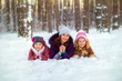 © kamaz007 - Children play with mom in winter. Two daughters and mom