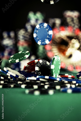 фотография Casino Concept background with dice, roulette and chips.
