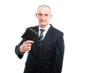 portrait of senior showing his black leather wallet