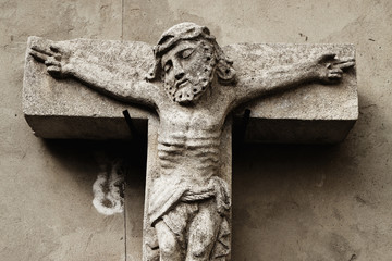 Wall Mural - crucifixion of Jesus Christ as a symbol of resurrection and immortality of the human soul (ancient stone statue)