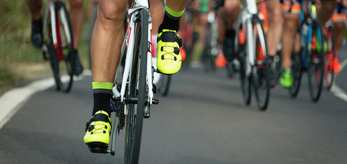 Wall Mural - Cycling competition cyclist athletes riding a race on the road