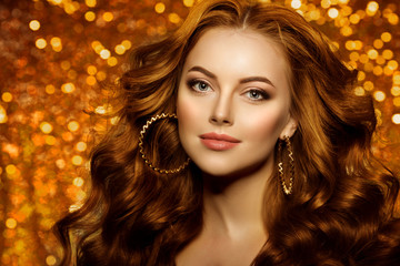 Golden beautiful fashion woman, model with shiny  healthy long volume hair. Waves curls updo volume hairstyle. Hair Salon.Girl with luxurious haircut on  gold background