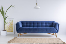 Blue sofa and wicker carpet