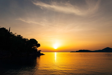 Wall Mural - Sunset over the sea. Sunset over the Adriatic Sea. Sun to sit down in the water