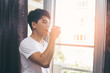 © Jestercine - Asian man drinking water at the morning, vintage color tone.