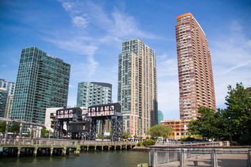 Wall Mural - Pier at Gantry Plaza State Park and buildings with blue sky, New York