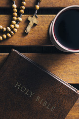 Wall Mural - Rosary beads, holy bible and cup of wine.