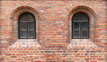 In A Red Brick Wall Of The Medieval Castle There Are Two Narrow Windows