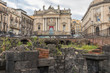 Catania, Sicily, Italy — Ruins of the Roman Amphitheater at the Stesicoro Square with San Biagio Church on background - 