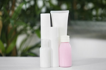 Wall Mural - Cosmetic bottles on blurred background