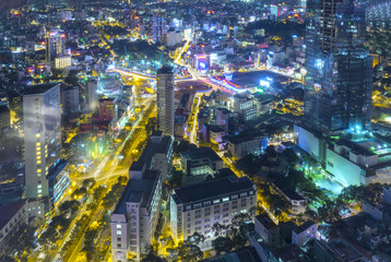 Ho Chi Minh City, Vietnam - April 11, 2017: Aerial night view of colorful and vibrant cityscape of downtown with traffic light trails
Skyline by night in Ho Chi Minh city, Vietnam