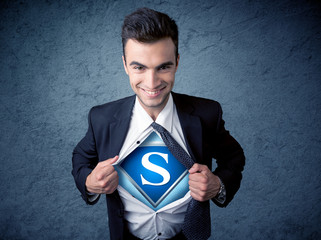 Businessman ripping off his shirt with superhero sign