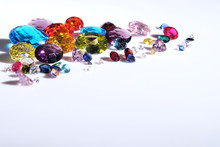 Colorful Of Different Gemstones With Space For Text On White Background.