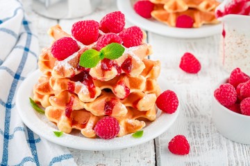Wall Mural - Homemade waffles with fresh raspberries for breakfast