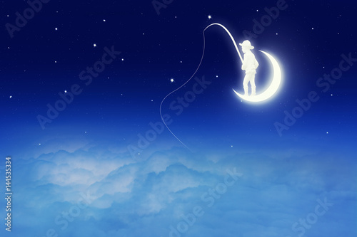 Zdjęcie XXL Konceptualny wizerunek chłopiec łapania ryba na księżyc