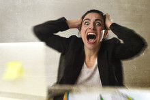 Woman In Business Suit Working In Stress Screaming Desperate Overwhelmed And Overworked