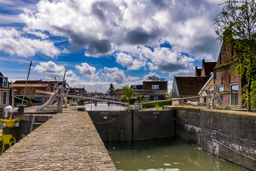 Fototapete - View at the lock and channel in Hindeloopen. The Netherlands.