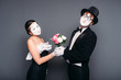 © Nomad_Soul - Pantomime actors performing with flower bouquet