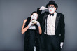 © Nomad_Soul - Mime actors performing, actress nibble alarm clock