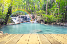 Scenery Of Erawan Waterfall In Thailand Montage With Wood Floors.