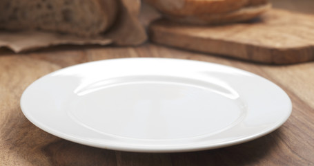 empty white plate on wood table for your dish, 4k photo