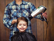 © alexkich - A little boy is trimmed in the hairdresser's