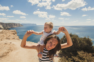 Beautiful mother and daughter outdoors