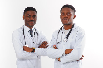 Two black doctors with stethoscope isolated on white