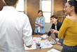 © amenic181 - Group of businesspersons having different age in creative business discussing work in the office