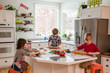 © RooM The Agency - Three Children making Christmas cookies