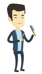 Wall Mural - Barber holding comb and scissors in hands.