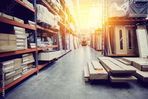 Fotografía Shelf with structural materials on the shelves in the construction warehouse
