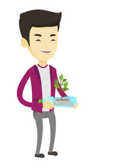 Poster - Man holding plant growing in plastic bottle.