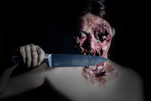  Horrible Scary Zombie Girl With A Kitchen Knife On Black Background With Copyspace