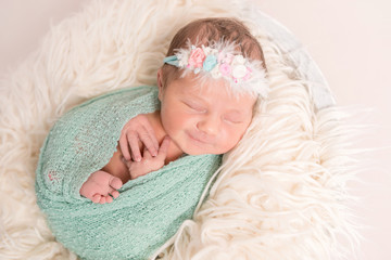 Aorable cute baby smiling in sleep, closeup