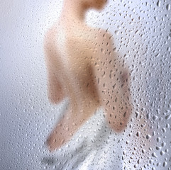 Beautiful naked woman with towel on white background, closeup