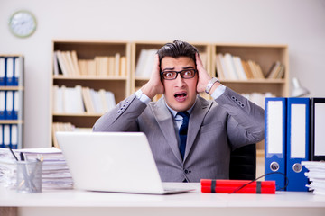 Wall Mural - Businessman with dynamite in the office