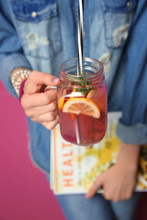 Young Woman With Jar Of Tasty Lemonade, Closeup