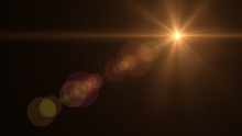 Lens Flare Light Over Black Background. Easy To Add Overlay Or Screen Filter Over Photos	