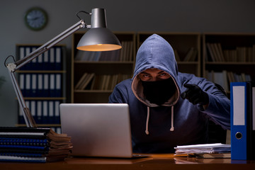 hacker stealing personal data from home computer