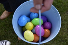 Colorful Easter Eggs In A Blue Bucket
