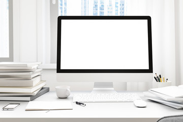 Poster - Front view of workpark with blank white computer screen, coffee cup, and book in home work. Mock up , 3D render
