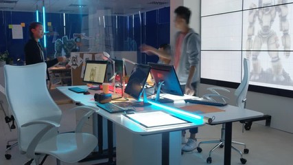  Time lapse young Asian video game designers collaborating on a project