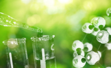 Wall Mural - test tube and drop of water with science chemical structure on green