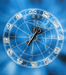 key lying on blue horoscope with zodiac symbols like a concept astrology and success, key to success