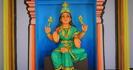 Wall Mural - Statue of a Hindu deity with Four Arms at a temple in Lankawi.