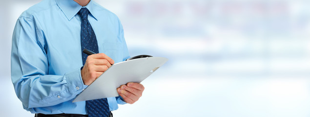 Wall Mural - Businessman hands with clipboard