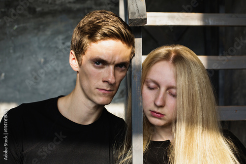 A Young Man And Young Blonde Woman With Long Hair Problems And