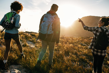 Wall Mural - young people on countryside hiking