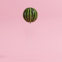 Wall Mural - outstanding watermelon balloon concept on pastel pink background for copyspace. minimal concept.